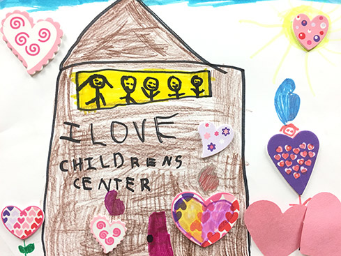 Childs drawing of a school that says I love Childrens Center
