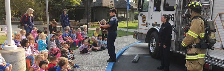 firefighter police officer and paramedic visit the school